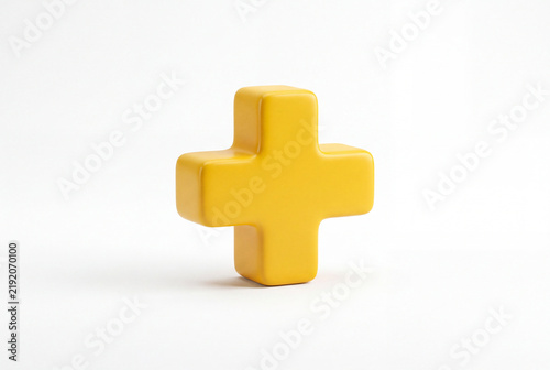 Yellow plus symbol representing healthcare and wellbeing concept