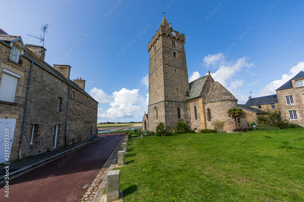 Fototapeta premium Stone Tower and Green Field in Cotentin, Normandy
