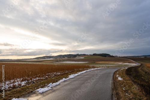 Rural landscape near Petersdorf under a cloudy winter sky