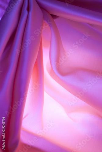 Quadro su tela Textura de fondo de tela de seda rosa iluminada