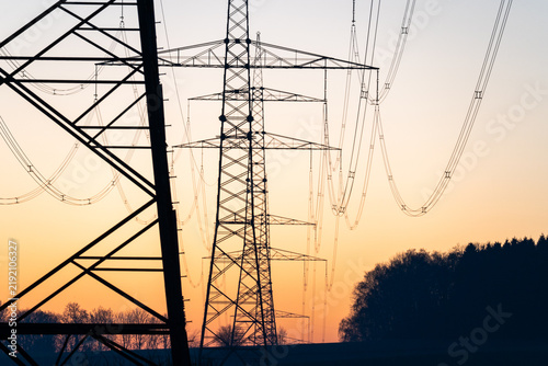 Electricity transmission pylons at sunset