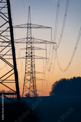 Electricity transmission towers at sunset
