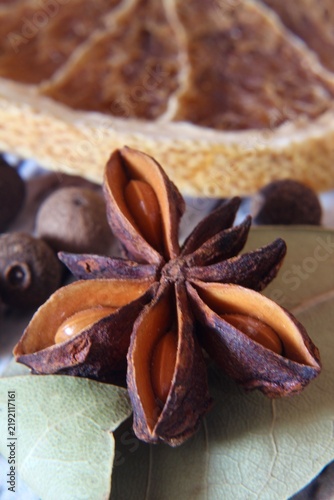 Quadro su tela Star anise, star pepper, bay leaf, dried orange, spices for mulled wine, close‑u