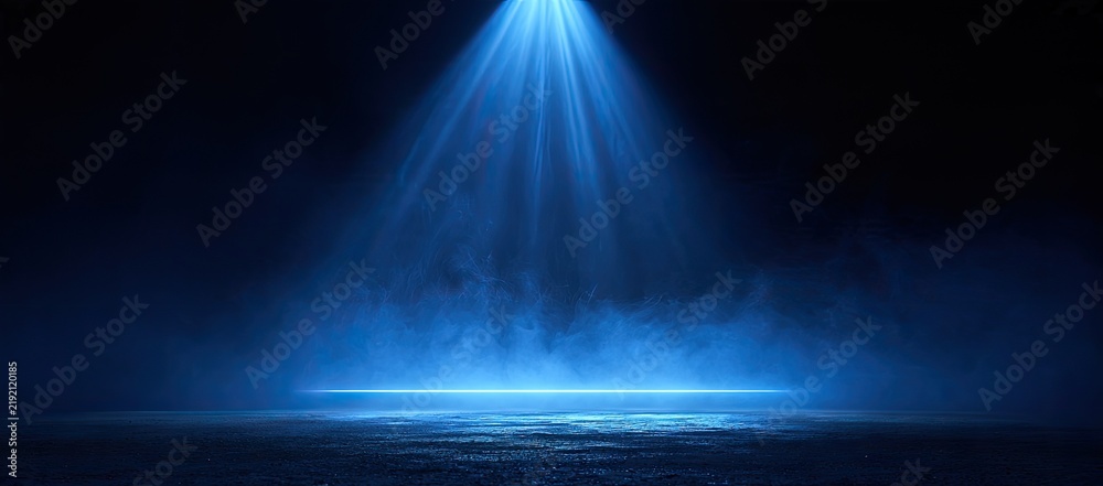 Obraz premium A vibrant blue spotlight cuts through dark atmospheric smoke on a textured floor
