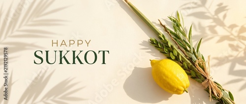Happy Sukkot greeting banner with traditional etrog, lulav and palm shadows on warm beige background