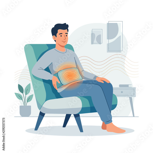 Man Relaxes with Heated Pad on Stomach for Pain Relief, Comfort, and Warmth in Cozy Living Room Setting