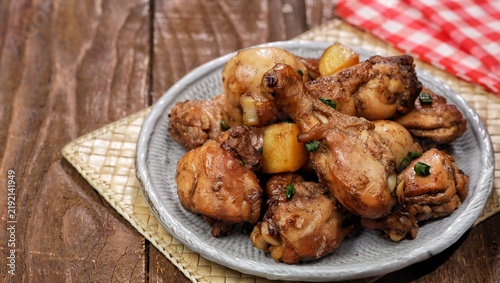 Quadro su tela Chicken adobo, a classic Filipino dish made with tender chicken, potato and egg simmered in a savory soy sauce and vinegar marinade with garlic and spices, served with steamed white rice
