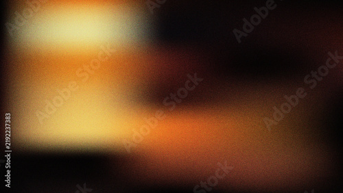 Vibrant golden orange and brown blurred background with a subtle dark vignette and fine grain texture effect