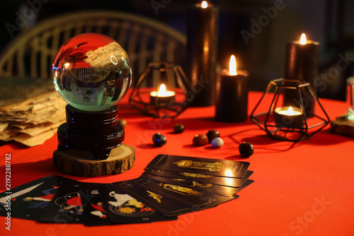 Obraz na plátně Fortune tellers magic attributes on red table in dark room, closeup