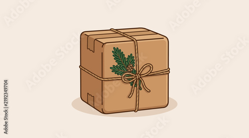 Brown cardboard gift box tied with rustic twine and decorated with a green pine sprig for holidays