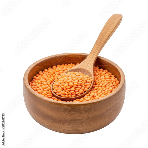 Red lentils in a wooden bowl with a spoon isolated on transparent background