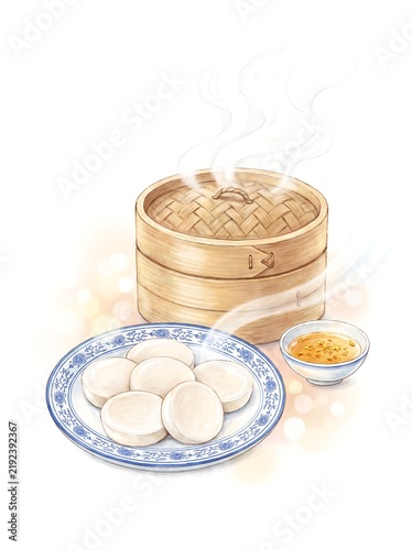 Bamboo steamer of white buns with soybean flour and small sauce dish