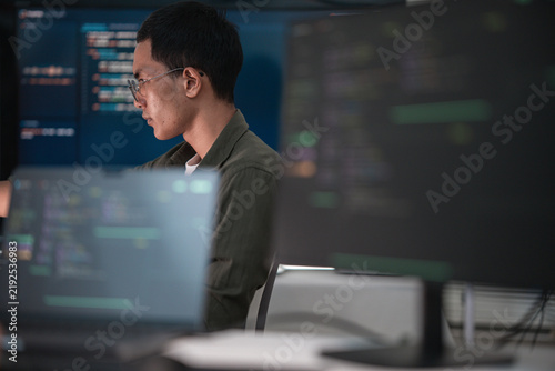 Software Developer Coding Artificial Intelligence In Modern Technology Workspace.