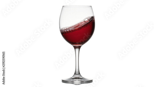 Obraz na płótnie Red wine splashing in a clear glass goblet, isolated on transparent background