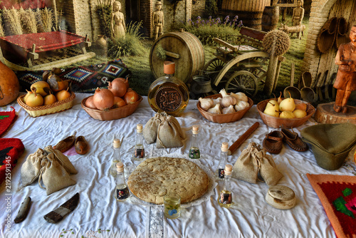 Bild auf Leinwand Traditional Serbian heritage display with food, drink, and crafts