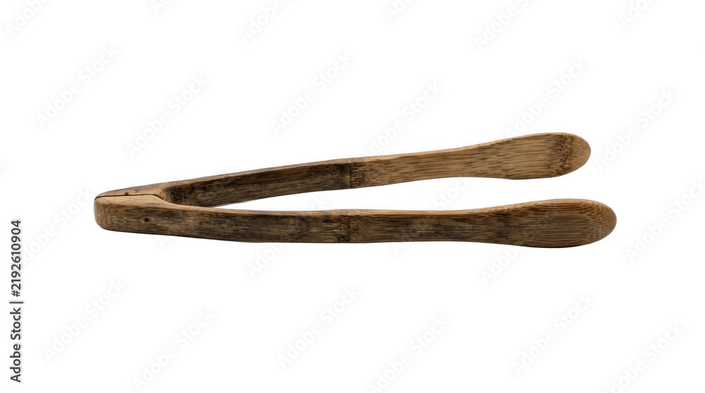 Fototapeta premium Dark rustic wooden serving tongs with long curved arms and rounded tips, ideal for handling toast, pastries, salads and kitchen foods naturally