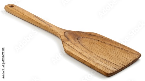 Wooden spatula with handle hole isolated on a white background representing natural kitchen utensils.