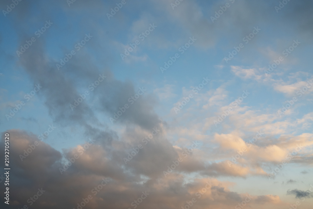 Obraz premium Soft Gray and Pink Clouds in Blue Evening Sky