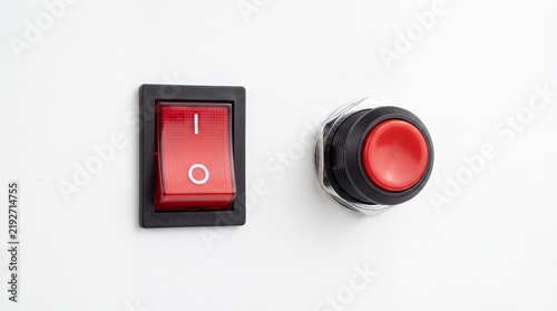 Plakat Rectangular red power rocker switch and circular push button electronic components isolated on white background