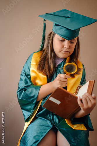 Fotografie Child student learning, researching, and growing with book