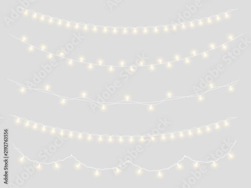 Warm Christmas garland featuring bright golden bulbs and tiny sparks. Curved strings create beautiful decorative borders. Transparent PNG set for seasonal artwork.