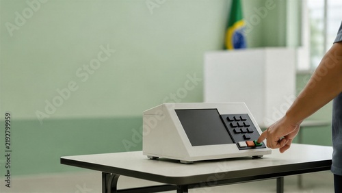 Voter presses an electronic voting machine in Brazil. A national flag marks the polling station. Democracy and civic participation define election coverage.