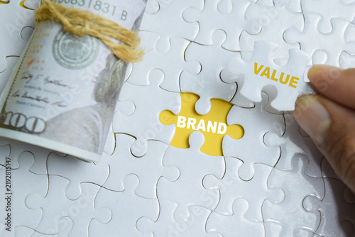 Piece of jigsaw puzzle brand value phrase. For identity and commercial worth