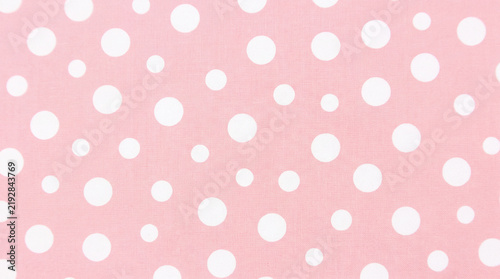 Pink Polka Dot Pattern: A vibrant and playful pattern featuring a cheerful arrangement of white polka dots scattered across a soft pink background, perfect for design and decoration.
