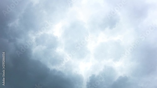 Dramatic Gray Storm Clouds with Bright Sunlight Breaking Through
