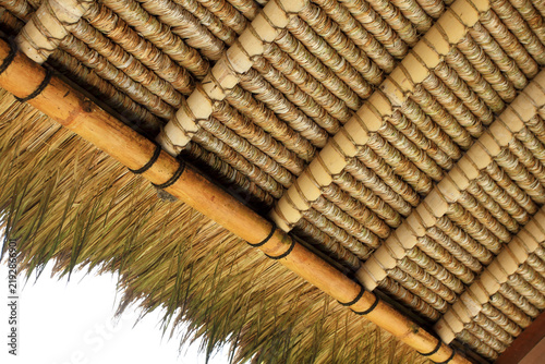 Bild auf Leinwand Close up of thatched roof crafted from dried grass and bamboo beams construction