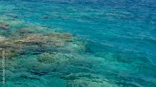 Video of the stones on the bottom with turquoise clear Mediterranean sea water. Crete, Greece