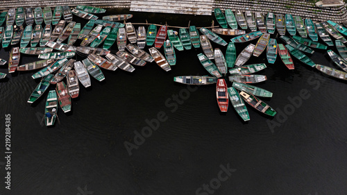 Obraz na plátne Colorful Boats on a Dark River