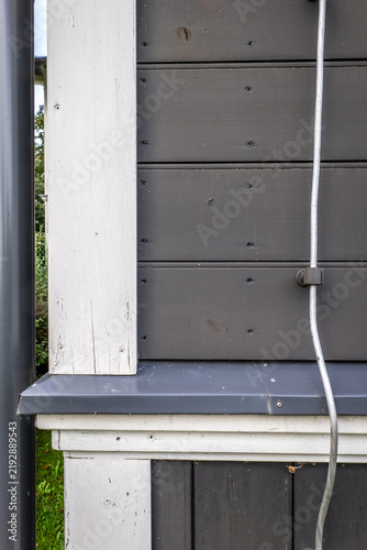 Konstfotografi Wooden Facade Detail with Metal Drip Edge and Lightning Conductor