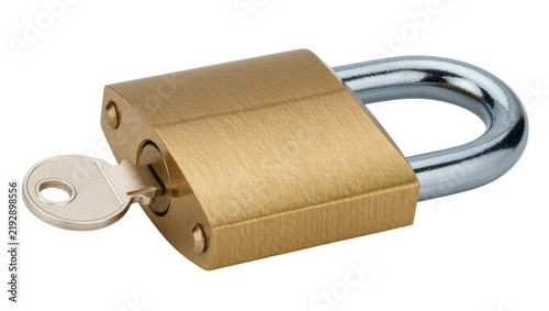 Foto Brass padlock with silver key inserted into lock mechanism, isolated on transpar