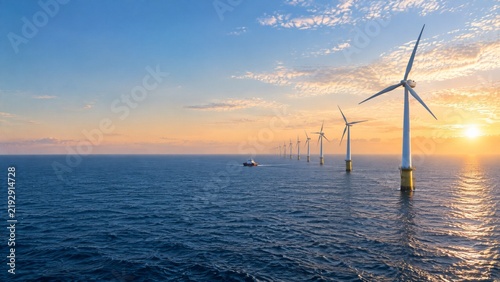 Offshore wind turbines generating renewable energy at sunset