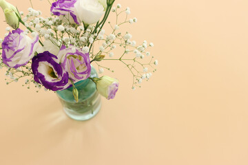 Top view image of romantic and delicate flowers on pastel background