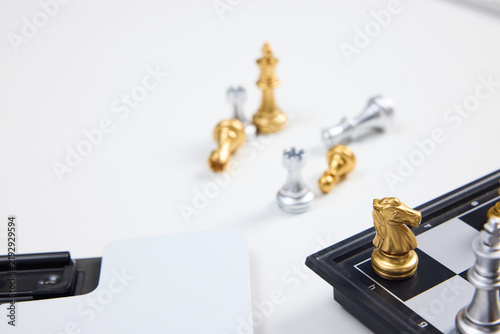 Фотография Chess Pieces on Board with Captured Pieces