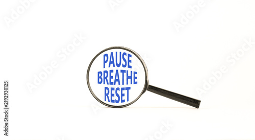 Pause breathe reset words symbol. Concept words Pause breathe reset in beautiful magnifying glass. Beautiful white background. Business support motivational and pause breathe reset concept. Copy space