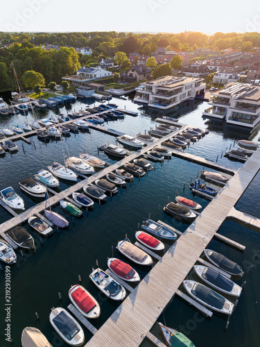 Obraz na plátně High angle vertical aerial drone photograph of marina berths, wooden pontoons, m