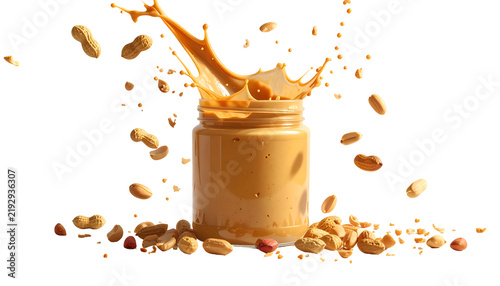 Jar of creamy spread with splash, peanuts falling, on black background