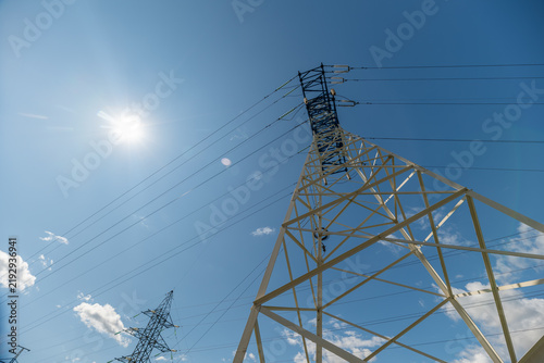 Quadro su tela Powerful structures stretch skyward capturing sunlight in a breathtaking display