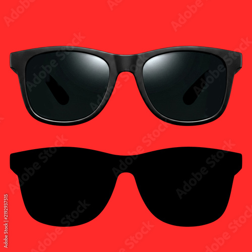 Obraz na plátne Classic matte black wayfarer sunglasses with their signature silhouette, isolated on a red background HD
