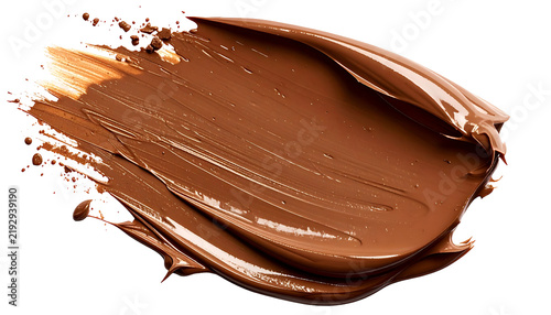 Close-up of a smear of smooth, rich chocolate spread on a dark background