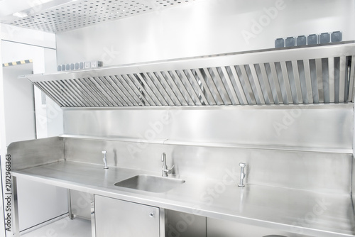 Konstfotografi Stainless steel kitchen sink and faucet in a professional kitchen