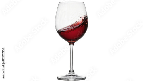 Fotografie Red wine splashing inside a clear glass goblet, isolated on transparent backgrou