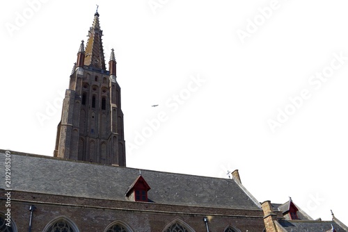 Historic gothic brick church tower and slate roof isolated on a white background