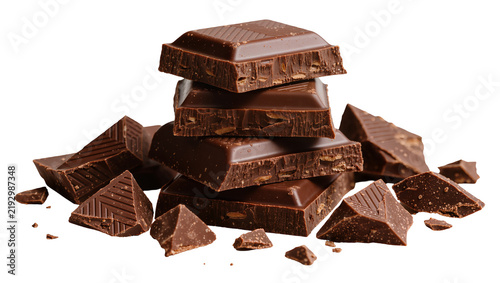 Картината върху платно Dark chocolate bar pieces stacked and scattered, isolated on transparent backgro