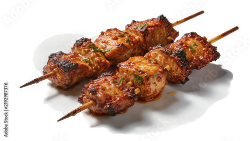 Grilled meat skewers with glaze and herbs, isolated on transparent background
