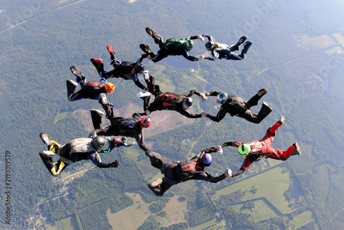 Skydivers make a formation teamwork