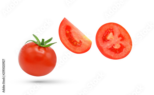 Whole and slices tomato falling in the air isolated on transparent background. PNG